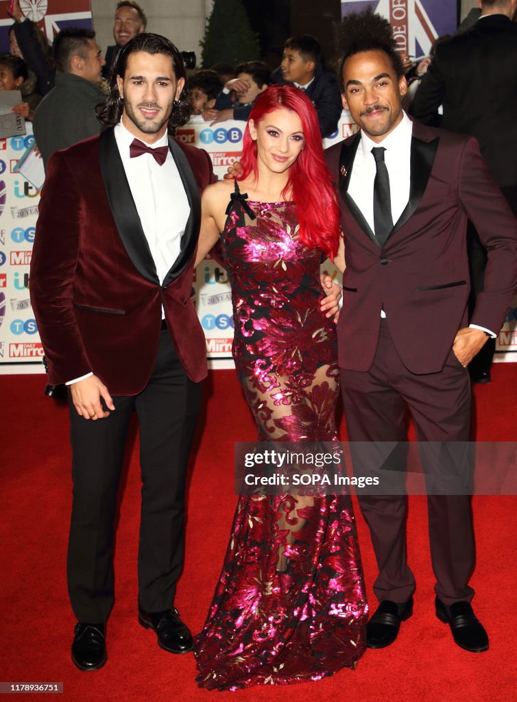 Graziano Di Prima, Dianne Buswell and Dev Griffin on the red...