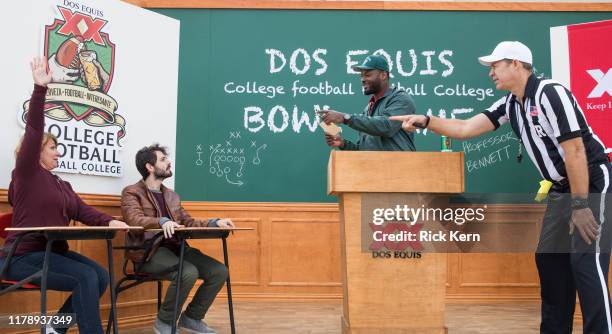 Football star Martellus Bennett quizzes football fans at the Dos Equis College Football Football College Bowl Game October 26, 2019 in College...