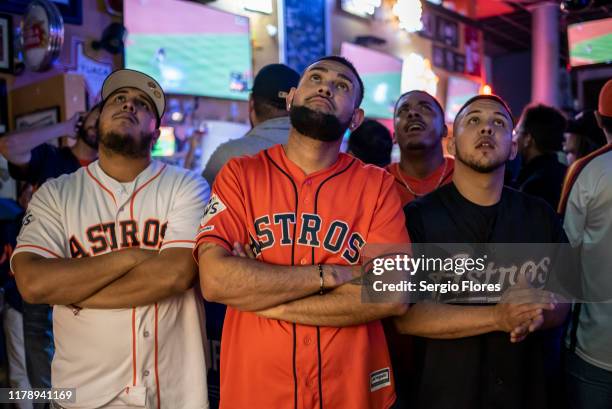Fans react to game 6 of the World Series between the Houston Astros and The Washington Nationals at Home Plate bar and grill near Minute Maid Park on...
