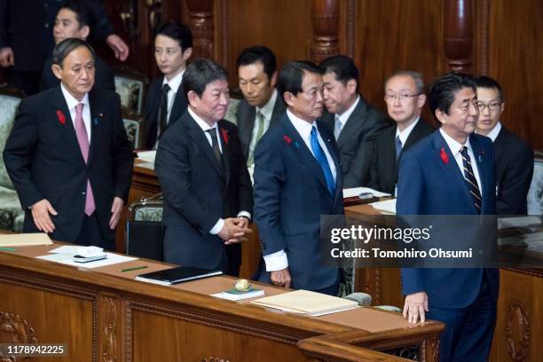 Japan's Prime Minister Shinzo, Deputy Prime Minister and Finance Minister Taro Aso, Foreign Minister Toshimitsu Motegi and Chief Cabinet Secretary...