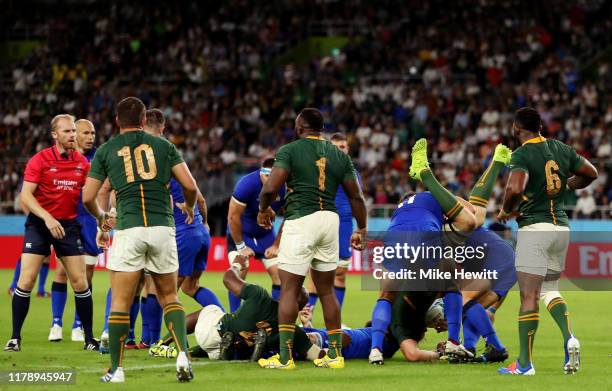 Duane Vermeulen of South Africa is fouled by Andrea Lovotti of Italy, resulting in Andrea Lovotti of Italy receiving a red card during the Rugby...