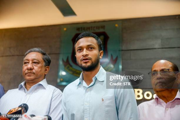 Bangladesh national cricket team captain Shakib Al Hasan speaks with media as Bangladesh Cricket Board president Nazmul Hassan Papon stands next to...