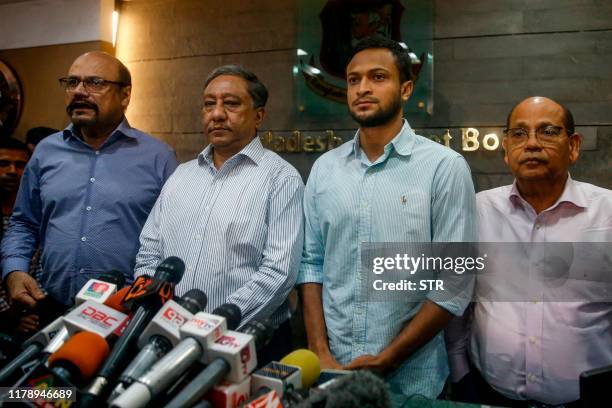 Bangladesh national cricket team captain Shakib Al Hasan speaks with media as Bangladesh Cricket Board president Nazmul Hassan Papon stands next to...