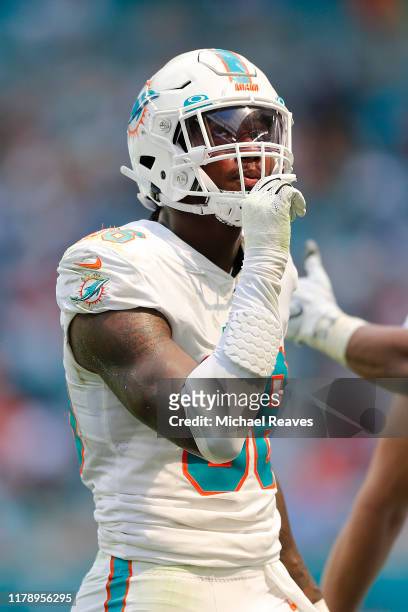 Taco Charlton of the Miami Dolphins looks on against the Los Angeles Chargers during the second quarter at Hard Rock Stadium on September 29, 2019 in...