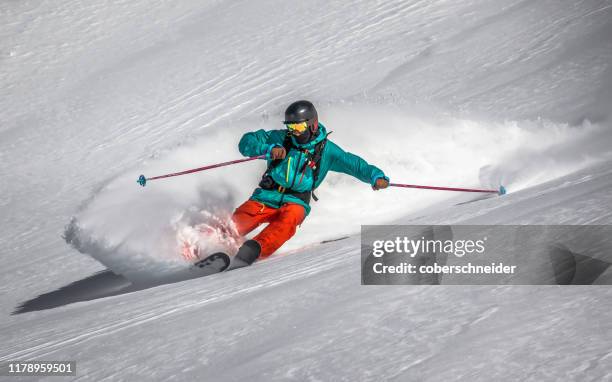 man skiing in powder snow, gastein, austria - österreichische zentralalpen stock-fotos und bilder