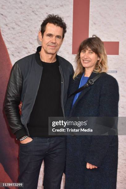 Tom Tykwer and Marie Steinmann attend the "Lara" premiere at Delphi movie theater on October 29, 2019 in Berlin, Germany.