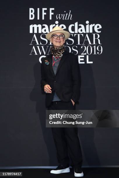 Director Yonfan arrives for the Marie Claire Asia Star Award 2019 during the day two of the 24th Busan International Film Festival on October 04,...