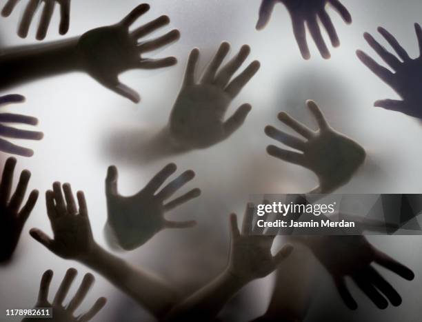 group of hands silhouettes - souls of my young sisters press reception stockfoto's en -beelden