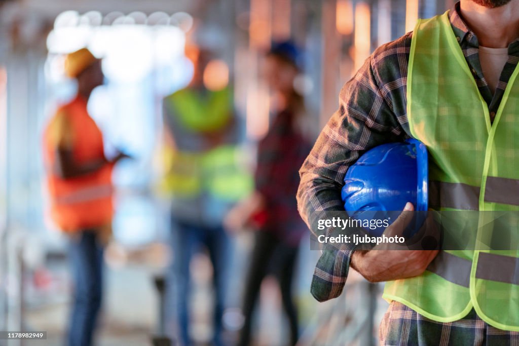 Man holding blue helmet close up