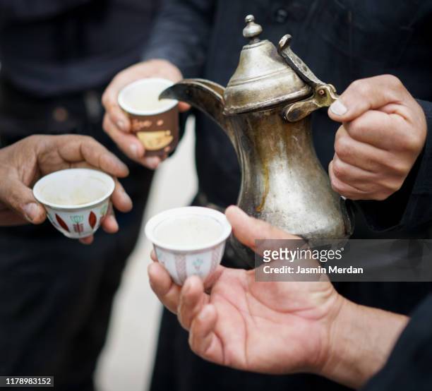 friends hands sharing coffee - religious service stock-fotos und bilder