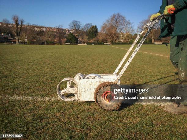 painting grass turf line - grounds crew stock pictures, royalty-free photos & images