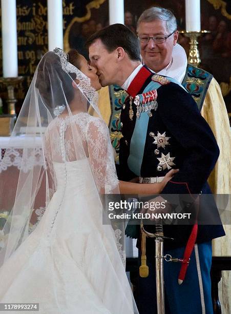 Prince Joachim of Denmark , Queen Margrethe's youngest son, kisses his bride, French Marie Cavallier on May 24, 2008 in Moegeltoender Church in South...