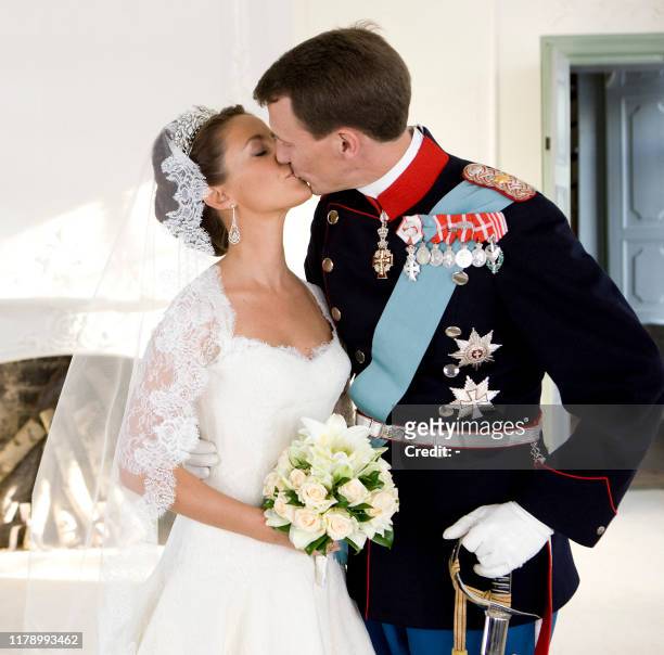 Prince Joachim of Denmark, Queen Margrethe's youngest son, kisses his bride, French Marie Cavallier, now Princesss Marie of Denmark, in this official...