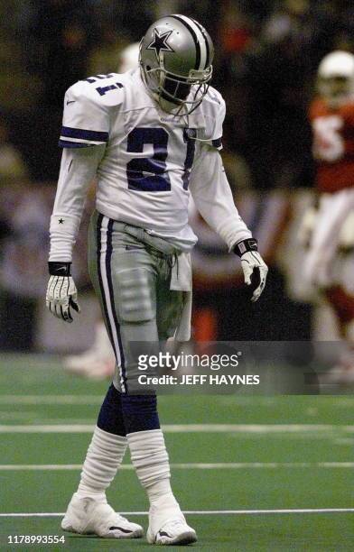 Deion Sanders of the Dallas Cowboys walks off the field during the second half of the NFC Wild Card game with the Arizona Cardinals 02 January at...