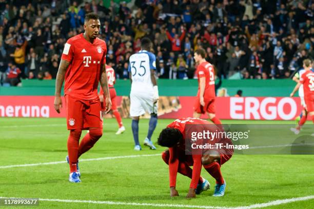 Jerome Boateng of FC Bayern Muenchen and Alphonso Davies of FC Bayern Muenchen looks dejected during the DFB Cup second round match between VfL...