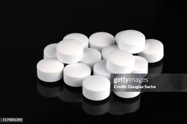 time released prescription pills on a black background - oxycodone stock pictures, royalty-free photos & images