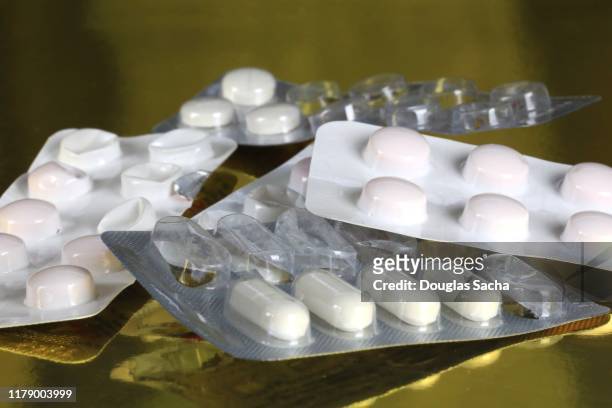 assortment of blister foil packed pills - blister pack stock-fotos und bilder