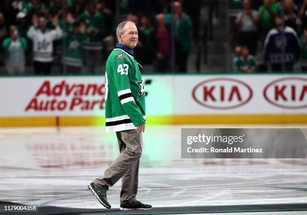 Former President George W. Bush on the ice before a game between the Boston Bruins and the Dallas Stars at American Airlines Center on October 03,...