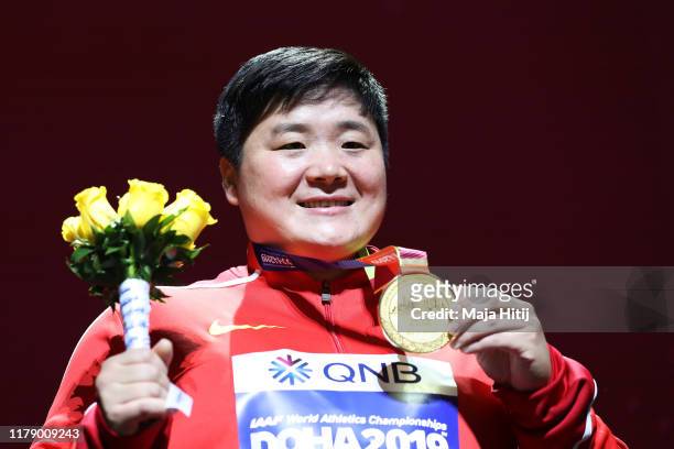 Gold medalist Lijiao Gong of China stands on the podium during the medal ceremony for the Women's Shot Put final during day eight of 17th IAAF World...