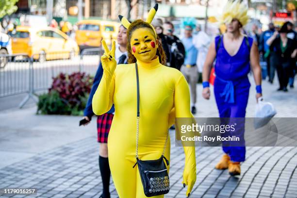 Cosplayer dressed as Detective Pikachu from Pokémon arrives at New York Comic Con on October 04, 2019 in New York City.