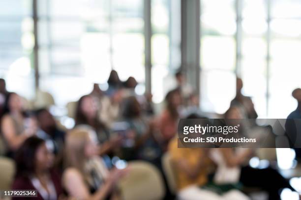 defocused photo of conference audience - seminar crowd stock pictures, royalty-free photos & images