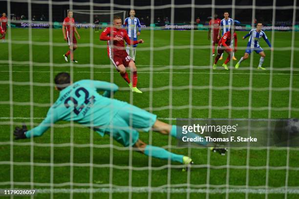 Rouwen Hennings of Duesseldorf scores a penalty against goalkeeper Rune Jarstein of Berlin during the Bundesliga match between Hertha BSC and Fortuna...