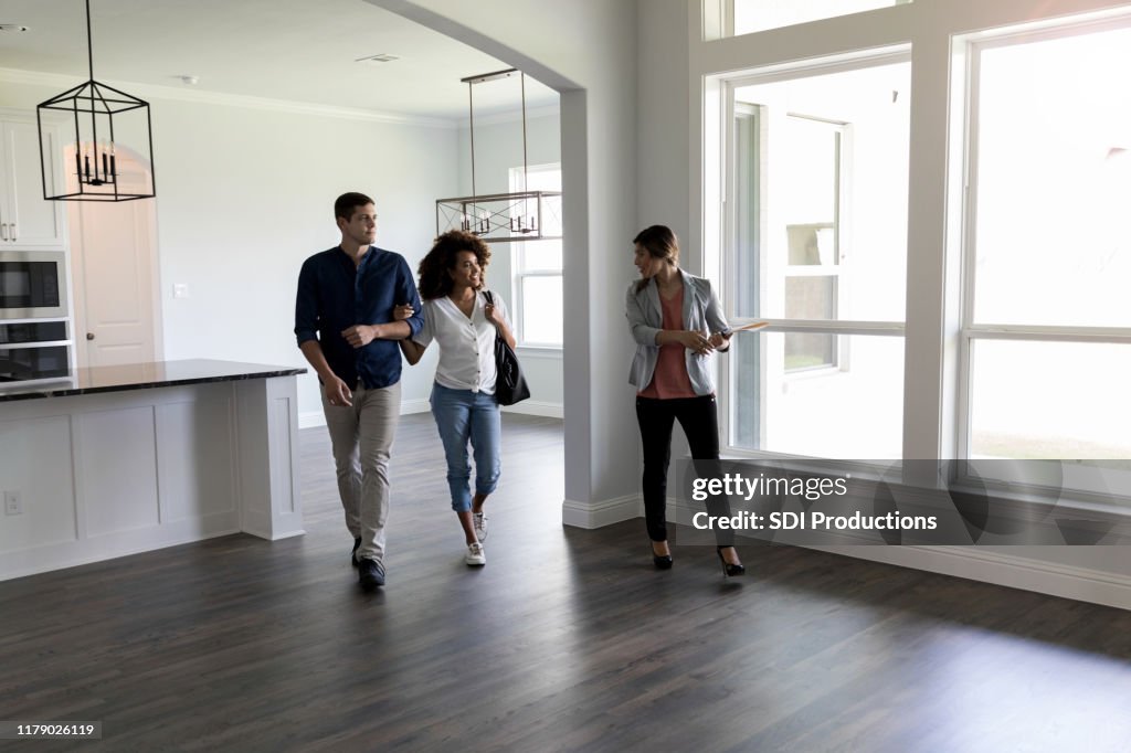 Couple meets with Real Estate Agent