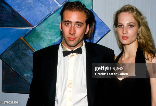 Nicolas Cage and Bridget Fonda pose for a photo circa 1987.