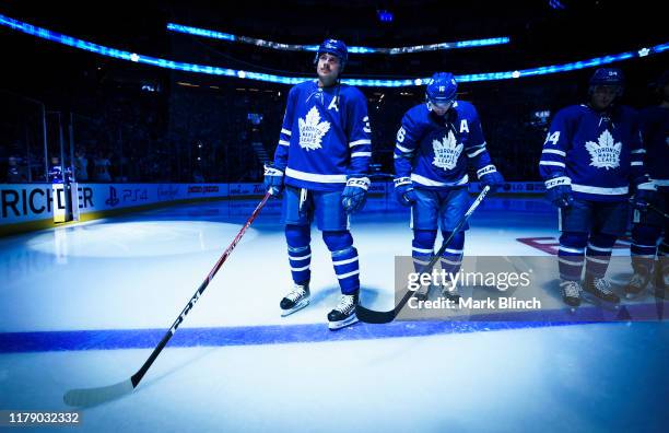 Auston Matthews of the Toronto Maple Leafs takes the ice as an alternate captain during opening night introductions ahead of playing the Ottawa...