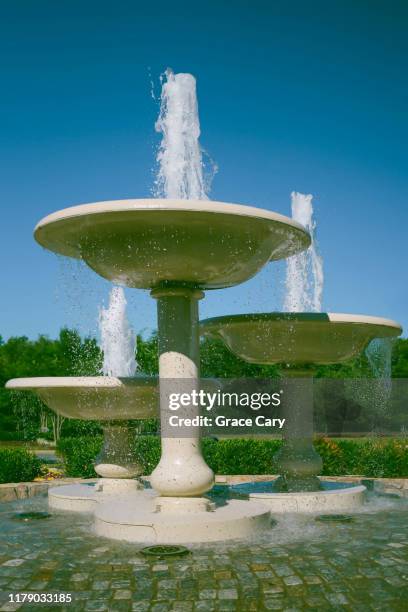 water flows from fountains in idyllic community - fredericksburg stock pictures, royalty-free photos & images