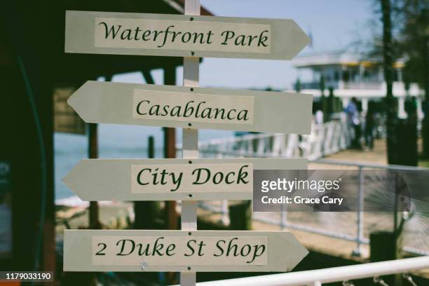 directional signs on old town alexandria waterfront - alexandria virginia foto e immagini stock