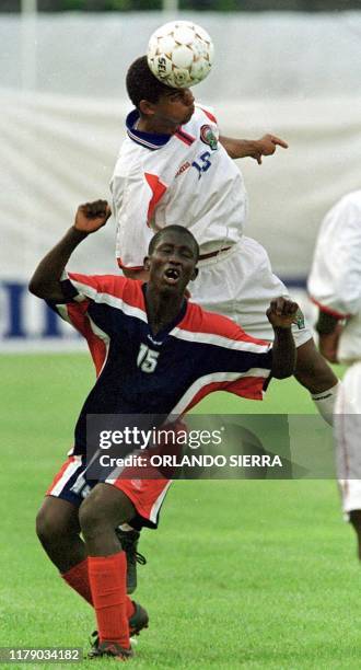 Cristan Bolanos of Costa Rica and Jean-Judain Delsa of Haiti fight for the ball, 6 May 2001 in San Pedro Sula, Honduras. El costarricense Cristian...