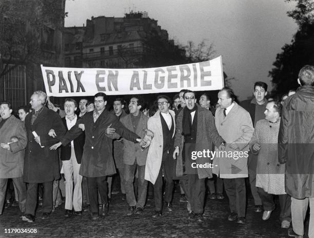 Demonstrators shout slogans in favor of independence and peace in Algeria on the Grands Boulevards in Paris on November 18 during one of the French...