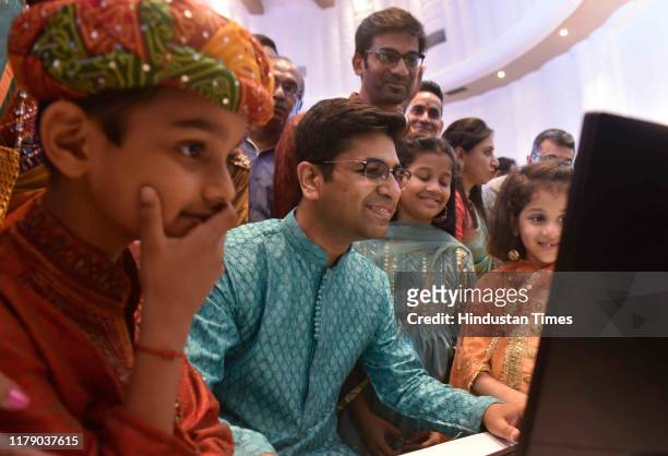 Stock broker with his family watch the Diwali Muhurat trading at Bombay Stock Exchange , on October 27, 2019 in Mumbai, India.
