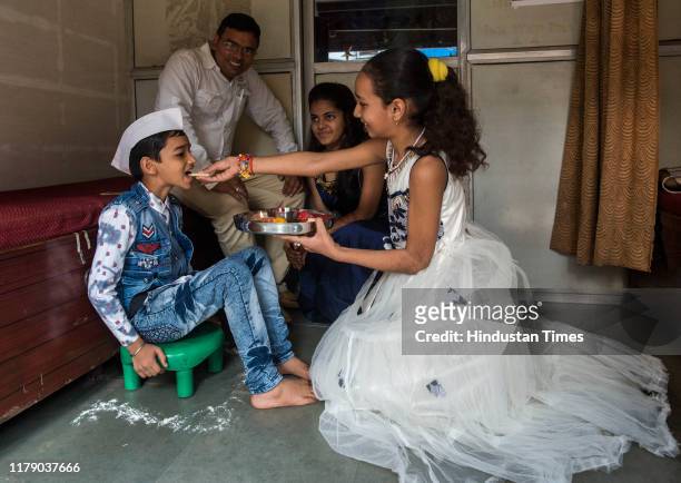Brother and sisters celebrate Bhai Dooj Festival at Bhandup, on October 29, 2019 in Mumbai, India.