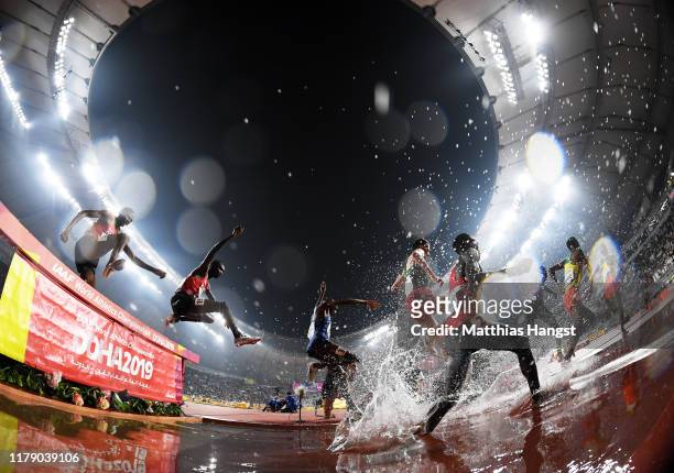 Athletes clear the water jump as they compete in the Men's 3000 metres Steeplechase final during day eight of 17th IAAF World Athletics Championships...