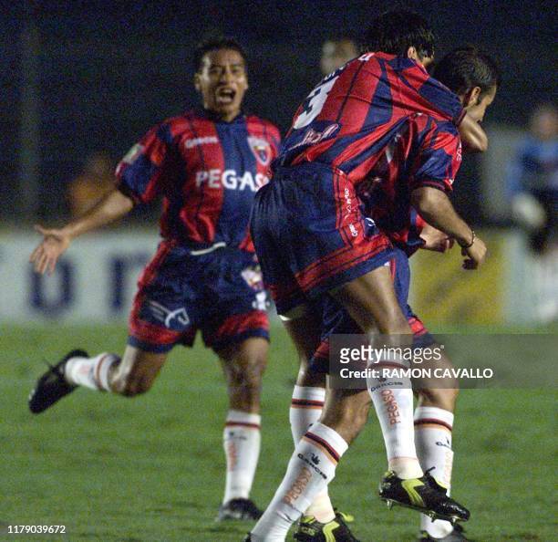 The soccer players from team Atlante, Salvador Carmona , Muiguel Gutierrez , and Jose Manuel Abundis , celebrate their second goal in a game against...