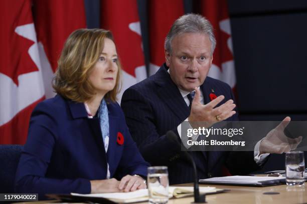 Stephen Poloz, governor of the Bank of Canada, right, speaks while Carolyn Wilkins, senior deputy governor at the Bank of Canada, listens during a...