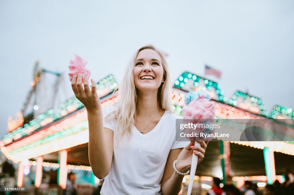 Teenage Woman Enjoying State Fair Food