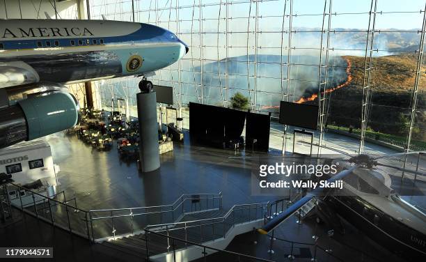 Former U.S. President Ronald Reagan's Air Force One sits on display at the Reagan Presidential Library as the Easy Fire burns in the hills on October...