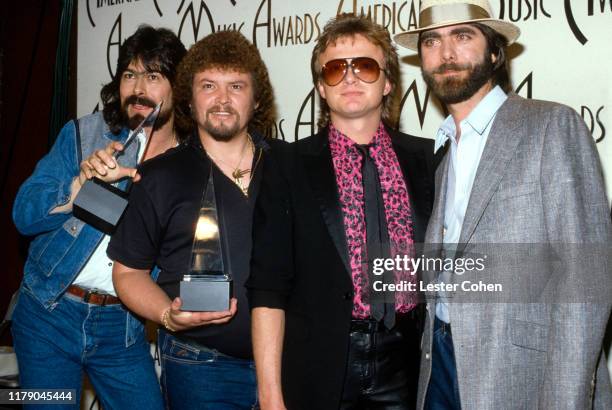Randy Owen, Jeff Cook , Mark Herndon, Teddy Gentry of Alabama attend the American Music Awards circa 1985. (Photo by Lester Cohen/ Getty Images