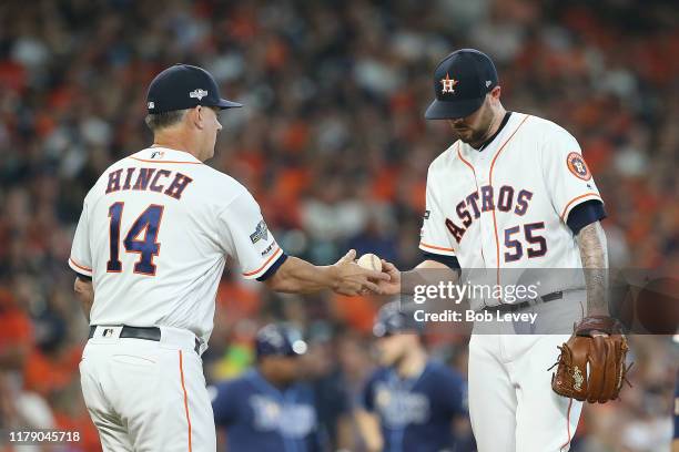 Ryan Pressly of the Houston Astros is taken out of the game by manager AJ Hinch during the eighth inning against the Tampa Bay Rays in game one of...