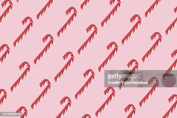 candy canes on the pink background - rosa germanica foto e immagini stock