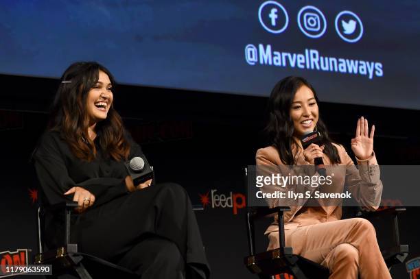 Ariela Barer and Lyrica Okano speak onstage during the "Marvel's Runaways" Panel at New York Comic Con 2019 - Day 2 at Hulu Theater at Madison Square...