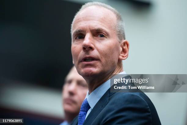 Dennis Muilenburg, CEO of Boeing, addresses the families of victims who died in Boeing 737 Max jet crashes, during the House Transportation and...