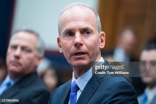 Dennis Muilenburg, CEO of Boeing, addresses the families of victims who died in Boeing 737 Max jet crashes, during the House Transportation and...