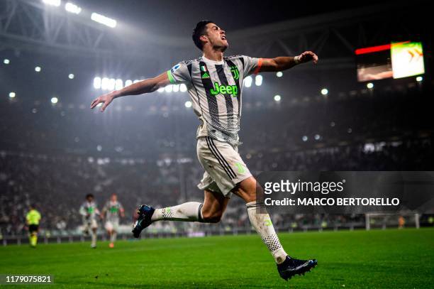 Juventus' Portuguese forward Cristiano Ronaldo celebrates scoring his team's second goal during the Italian Serie A football match between Juventus...