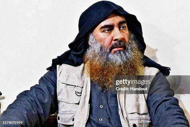 In this undated handout image provided by the Department of Defense, ISIS leader Abu Bakr al-Baghdadi is seen in an unspecified location. On October...