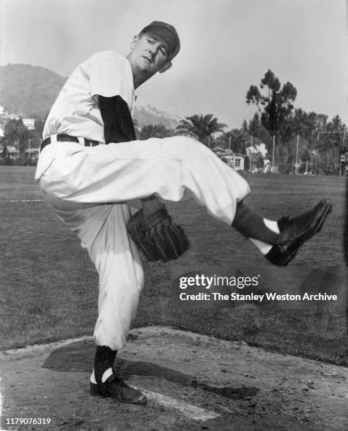 Pitcher Johnny Schmitz of the Chicago Cubs poses for an action portrait before an MLB Spring Training game circa March, 1951 at Wrigley Field in Los...