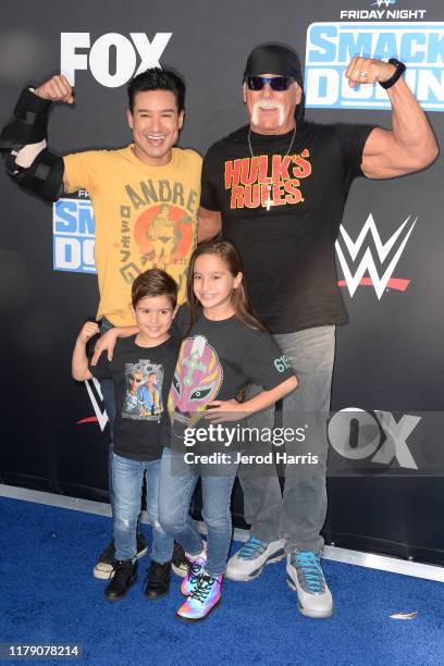 Mario Lopez and Hulk Hogan pose with Dominic and Gia Francesca at the WWE 20th Anniversary Celebration Marking Premiere of WWE Friday Night SmackDown...